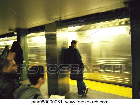 People standing on subway platform View Large Photo Image Stock Image - People standing on subway platform. Fotosearch