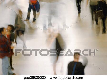 Stock Image - People walking, high angle view, blurred. Fotosearch