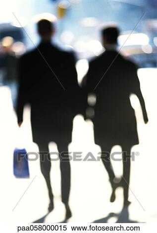 Silhouettes of women in street, blurred View Large Photo Image Stock Photography - Silhouettes of women in street, blurred. Fotosearch
