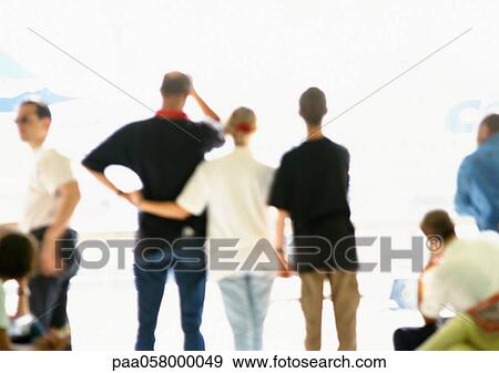 Three people side by side, rear view, blurred View Large Photo Image Stock Photo - Three people side by side, rear view, blurred. Fotosearch