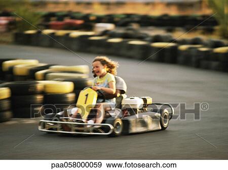 Two people go-carting, blurred motion View Large Photo Image Stock Photo - Two people go-carting, blurred motion. Fotosearch