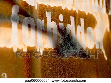 Stock Illustration - Forbidden text in white letters on wall, painted over, close-up. Fotosearch