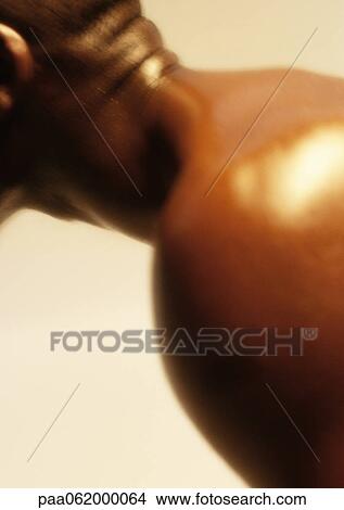 Man leaning forward stretching neck, close up. View Large Photo Image Picture - Man leaning forward stretching neck, close up.. Fotosearch