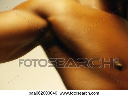 Man's bare chest and bicep, close up. View Large Photo Image Stock Image - Man's bare chest and bicep, close up.. Fotosearch