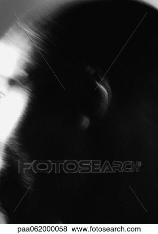 Stock Photo - Man's ear, close up, black and white, blurred.. Fotosearch