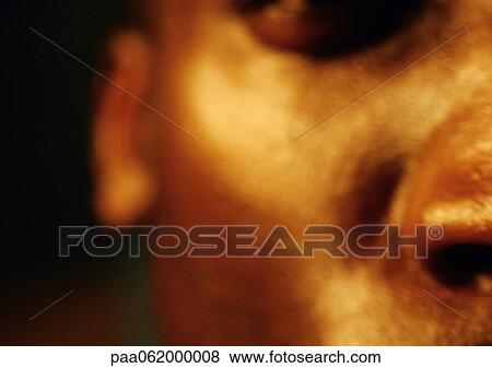 Stock Photo - Man's face, partial view, close up, blurred.. Fotosearch