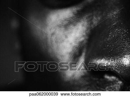 Stock Photo - Man's nose, front view, close up, black and white.. Fotosearch