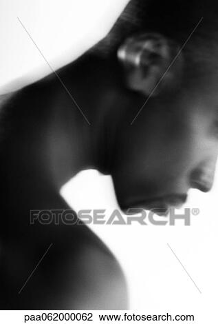 Stock Image - Man's profile, head looking down, close up, black and white.. Fotosearch