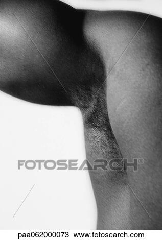Stock Image - Man's underarm and bicep, close up, black and white.. Fotosearch