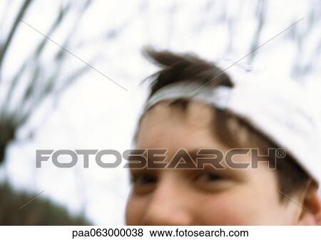 Boy wearing cap, partial view, close up, blurred View Large Photo Image Stock Photo - Boy wearing cap, partial view, close up, blurred. Fotosearch