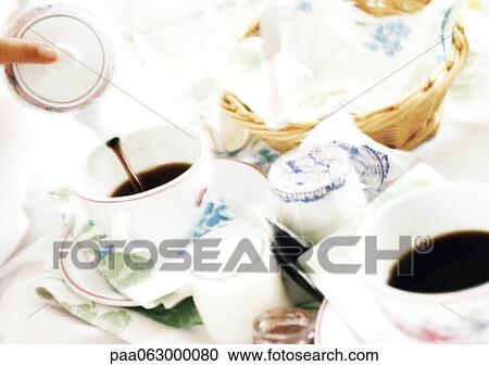 Stock Image - Breakfast on table, close-up, blurred. Fotosearch
