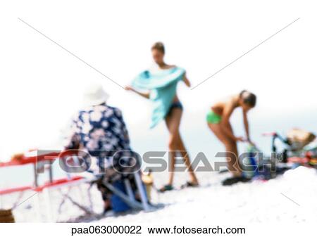 Group of people on beach, blurred View Large Photo Image Stock Image - Group of people on beach, blurred. Fotosearch
