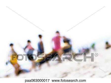 Stock Photo - Group of people on beach, blurred. Fotosearch