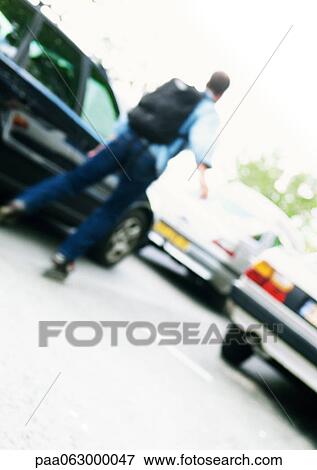 Inline skater skating among cars, blurred View Large Photo Image Stock Photo - Inline skater skating among cars, blurred. Fotosearch