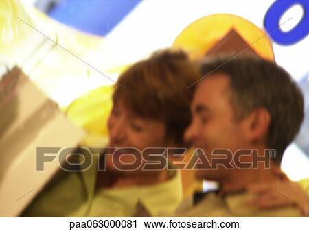 Man and woman smiling together, blurred. View Large Photo Image Stock Image - Man and woman smiling together, blurred.. Fotosearch