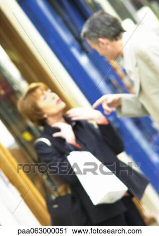 Man and woman talking and gesturing, blurred View Large Photo Image Stock Image - Man and woman talking and gesturing, blurred. Fotosearch