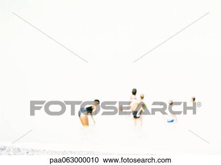 Stock Image - People at beach, blurred.. Fotosearch