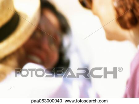 Stock Image - People hugging, close up, blurred. Fotosearch
