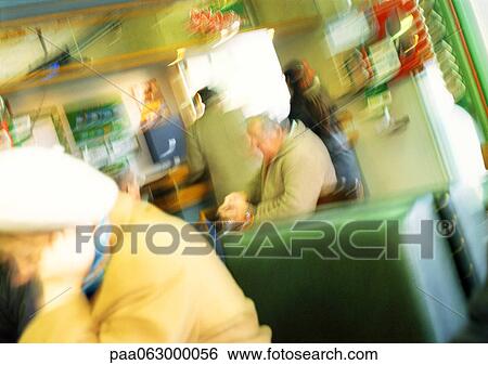 People in cafe, blurred View Large Photo Image Stock Photograph - People in cafe, blurred. Fotosearch