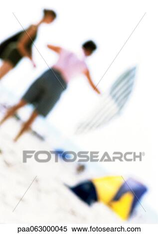 People on beach with parasol, blurred View Large Photo Image Stock Photography - People on beach with parasol, blurred. Fotosearch