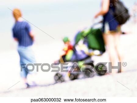 People with stroller on beach, blurred View Large Photo Image Stock Image - People with stroller on beach, blurred. Fotosearch