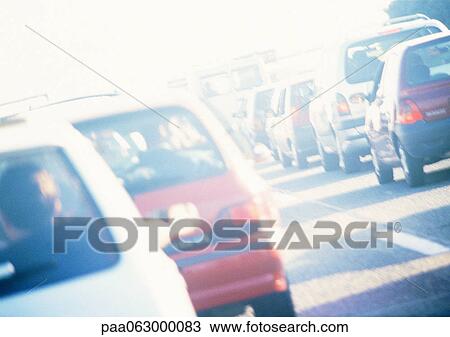 Stock Image - Traffic in street, rear view, blurred. Fotosearch