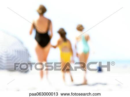 Women and children standing on the beach, blurred View Large Photo Image Stock Image - Women and children standing on the beach, blurred. Fotosearch
