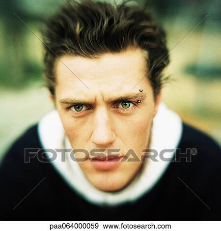 Young man looking at camera, close-up, portrait. View Large Photo Image Stock Photo - Young man looking at camera, close-up, portrait.. Fotosearch