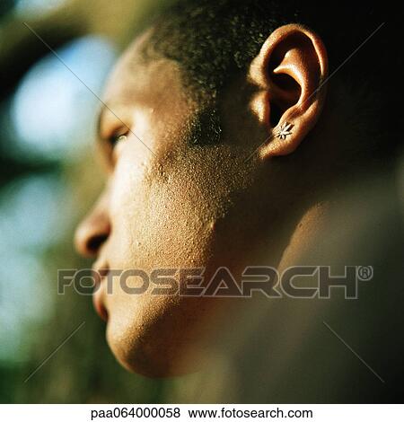 Young man, side view, low angle view, close up, portrait. View Large Photo Image Stock Photo - Young man, side view, low angle view, close up, portrait.. Fotosearch