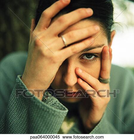 Stock Photography - Young woman, hands over face, outside, close up, portrait.. Fotosearch