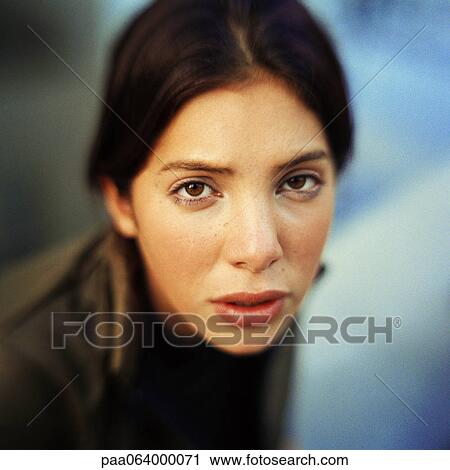 Young woman looking at camera, close-up, portrait. View Large Photo Image Stock Image - Young woman looking at camera, close-up, portrait.. Fotosearch
