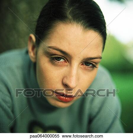 Young woman looking at camera, close-up, portrait. View Large Photo Image Stock Photography - Young woman looking at camera, close-up, portrait.. Fotosearch