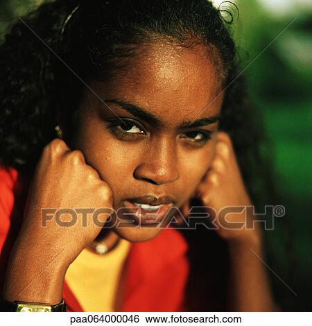 Young woman outside, hands to cheeks, close up, portrait View Large Photo Image Stock Photograph - Young woman outside, hands to cheeks, close up, portrait. Fotosearch