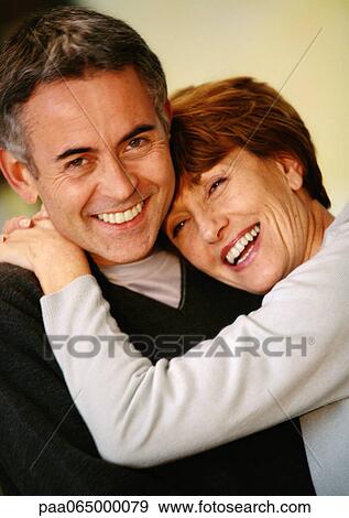 Stock Photo - Man and woman hugging, close up, portrait.. Fotosearch