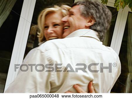 Man and woman hugging, rear view, blurred View Large Photo Image Stock Photo - Man and woman hugging, rear view, blurred. Fotosearch
