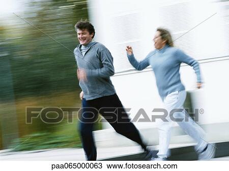 Man and woman jogging together outside, blurred. View Large Photo Image Stock Image - Man and woman jogging together outside, blurred.. Fotosearch