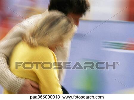 Man and woman walking together, side view, man's arm around woman, blurred View Large Photo Image Stock Image - Man and woman walking together, side view, man's arm around woman, blurred. Fotosearch