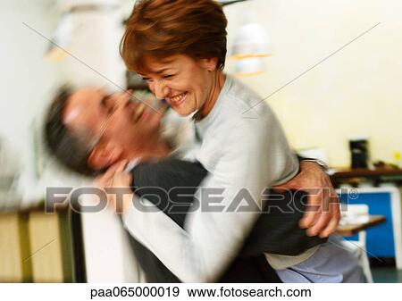 Man holding woman in arms, blurred. View Large Photo Image Stock Photo - Man holding woman in arms, blurred.. Fotosearch