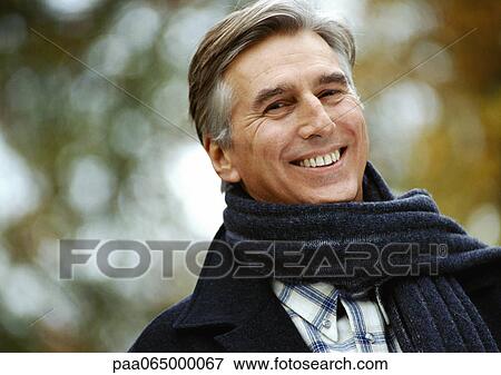 Man smiling, scarf around neck, head and shoulders, close up, portrait View Large Photo Image Stock Photo - Man smiling, scarf around neck, head and shoulders, close up, portrait. Fotosearch