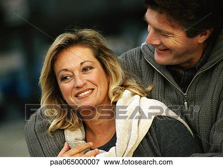 Man with arm around woman, head and shoulders View Large Photo Image Stock Photo - Man with arm around woman, head and shoulders. Fotosearch