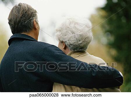 Man with arm around woman, head and shoulders, rear view View Large Photo Image Stock Photo - Man with arm around woman, head and shoulders, rear view. Fotosearch