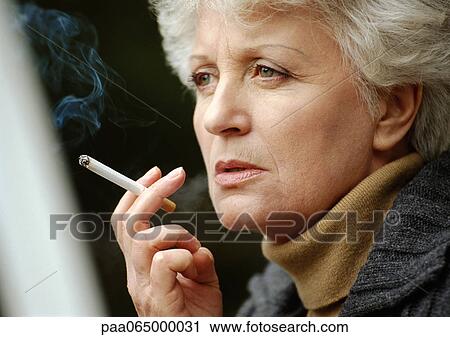 Woman smoking cigarette, close up. View Large Photo Image Stock Image - Woman smoking cigarette, close up.. Fotosearch
