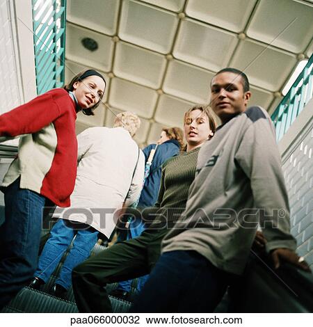 People going up escalator, close up. View Large Photo Image Stock Image - People going up escalator, close up.. Fotosearch