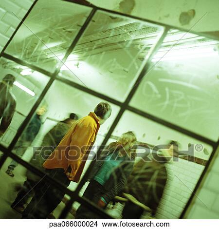 People walking through corridor, viewed through mirror. View Large Photo Image Picture - People walking through corridor, viewed through mirror.. Fotosearch