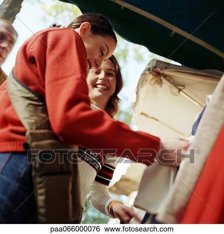 Young people shopping at outdoor market. View Large Photo Image Stock Photograph - Young people shopping at outdoor market.. Fotosearch