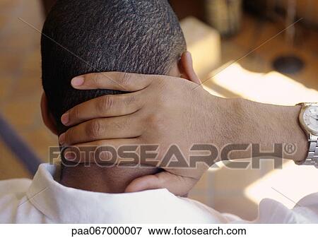 Man, hand on back of neck, rear view, close-up View Large Photo Image Stock Photo - Man, hand on back of neck, rear view, close-up. Fotosearch