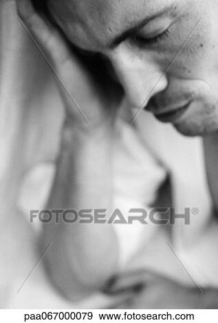 Man holding head in hand, close-up, black and white. View Large Photo Image Stock Photo - Man holding head in hand, close-up, black and white.. Fotosearch