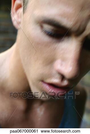 Stock Image - Man's face, close-up, blurred.. Fotosearch