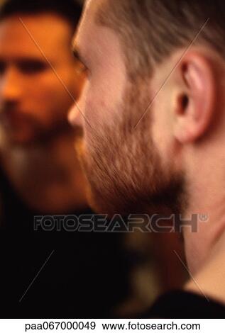 Man's face, view from over the shoulder, man's reflection in mirror in background View Large Photo Image Stock Photo - Man's face, view from over the shoulder, man's reflection in mirror in background. Fotosearch