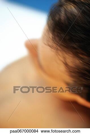 Picture - Man's head, high angle view, blurred . Fotosearch